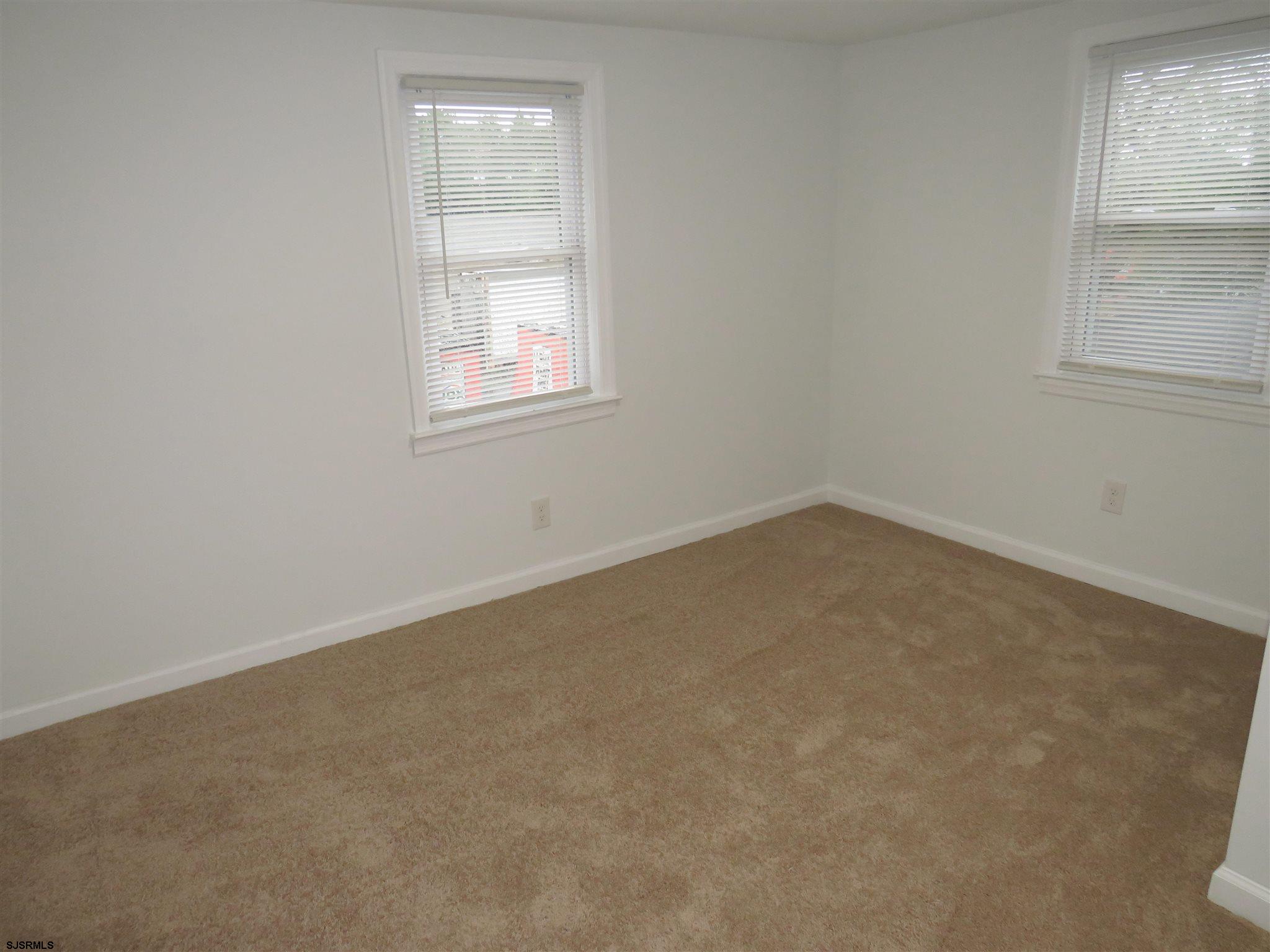 1702 Somers Point Road Egg Harbor Township, NJ 08234 - Photo 23 of 25 an empty room with a window