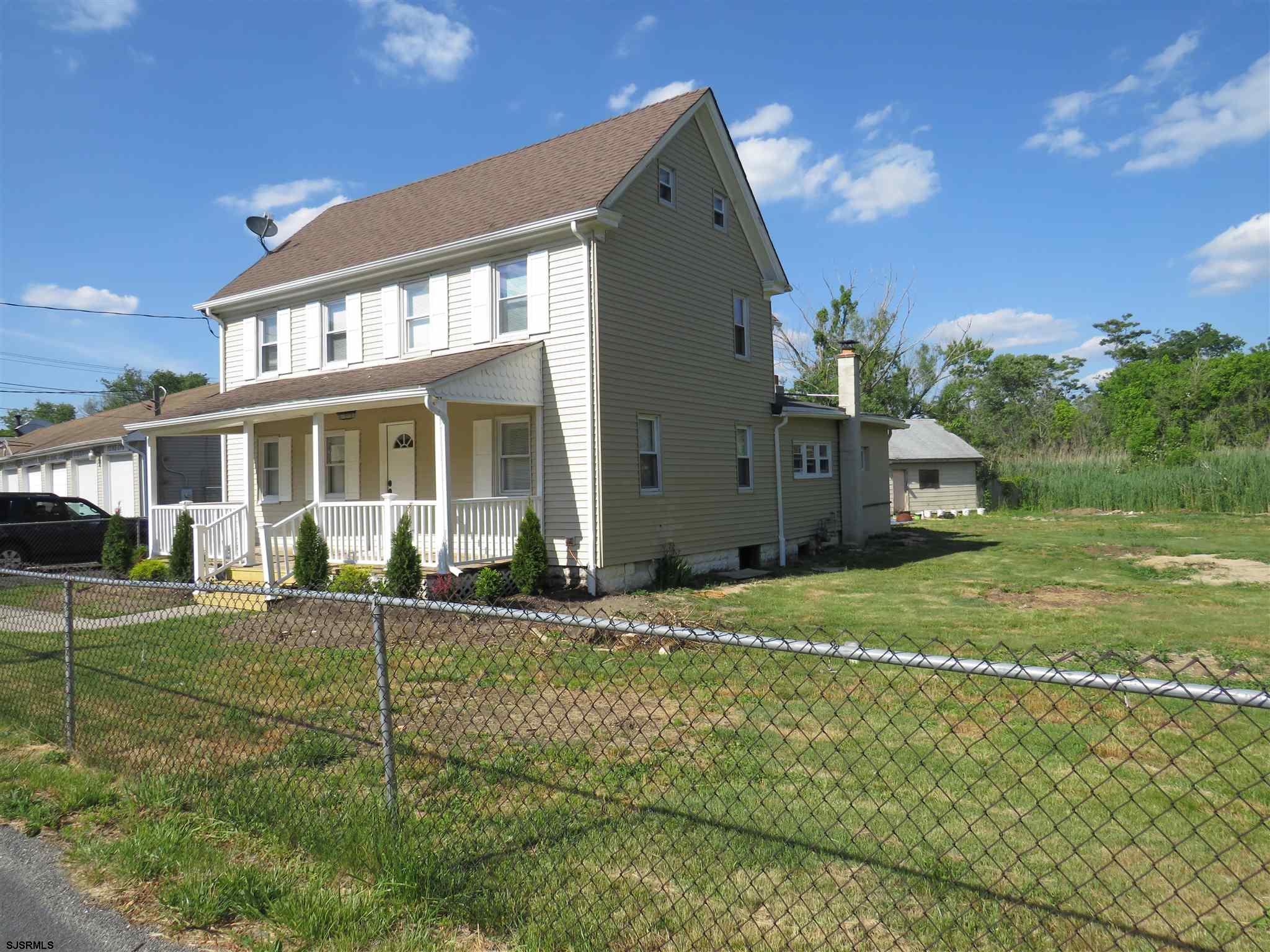 1702 Somers Point Road Egg Harbor Township, NJ 08234 - Photo 4 of 25 a front view of a house with a yard