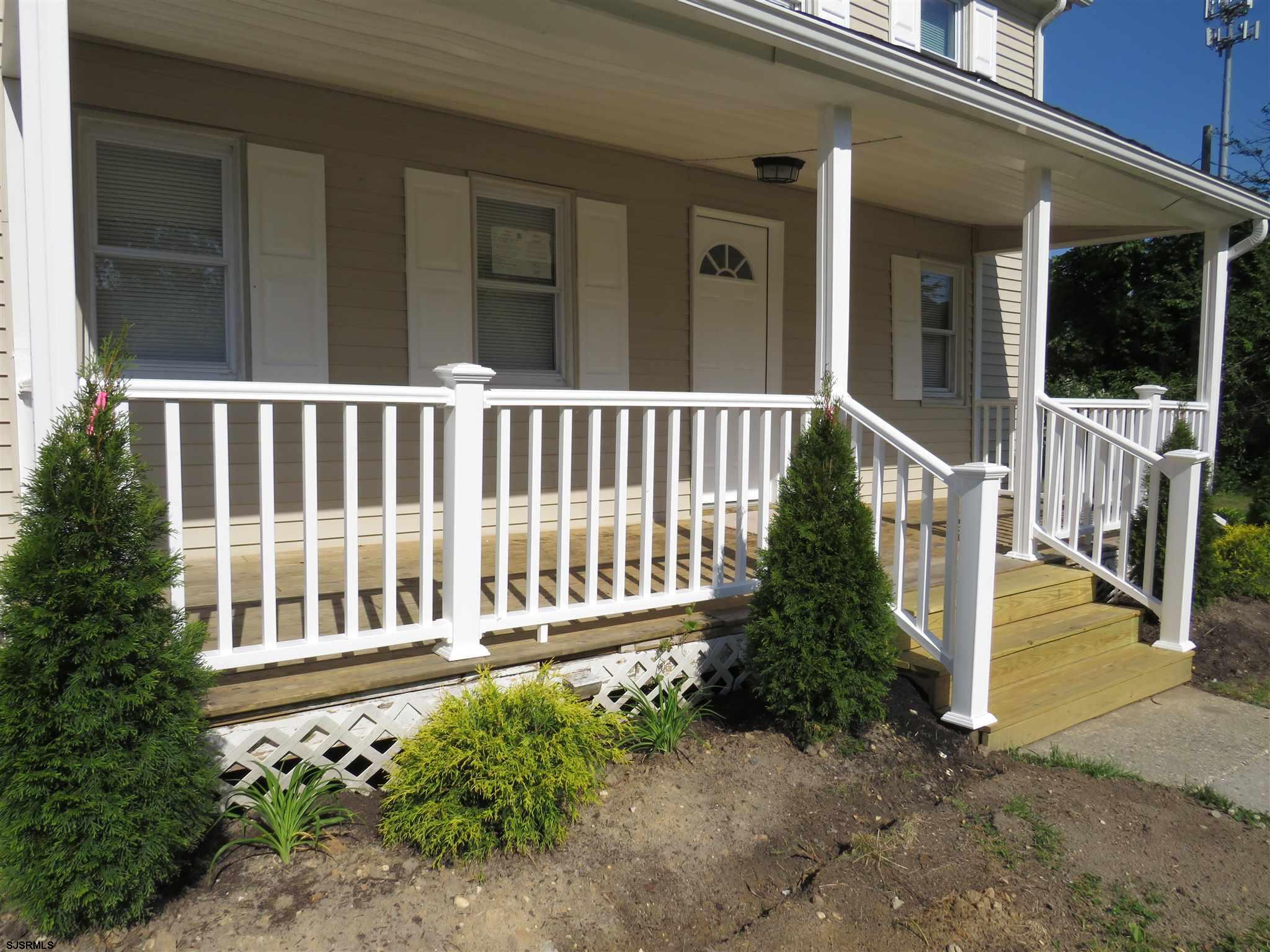 1702 Somers Point Road Egg Harbor Township, NJ 08234 - Photo 5 of 25 a porch with a bench in front of house
