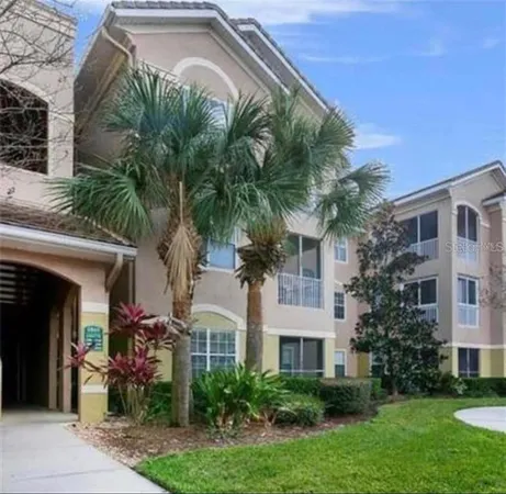 a front view of multiple houses with yard