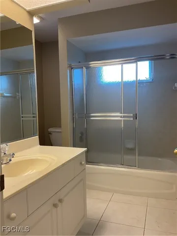 a bathroom with a tub and shower