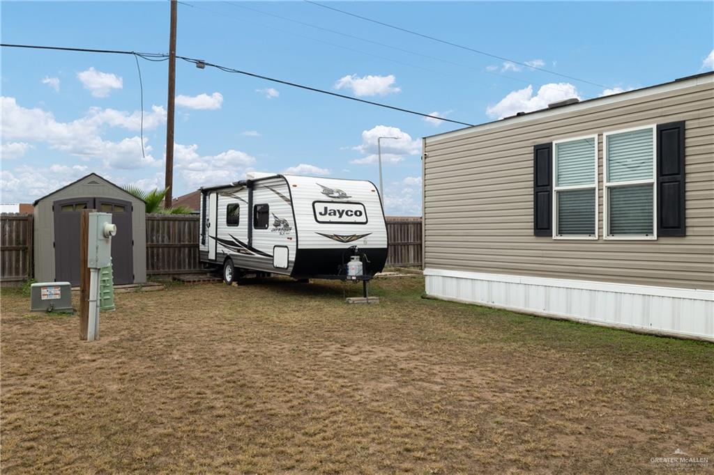 3118 Primrose Drive Weslaco, TX 78596 - Photo 12 of 12 View of vehicle parking featuring a storage shed