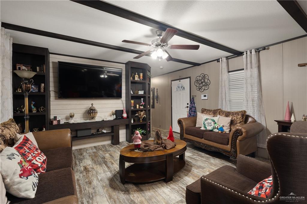 3118 Primrose Drive Weslaco, TX 78596 - Photo 2 of 12 Living room featuring wood finished floors and ceiling fan