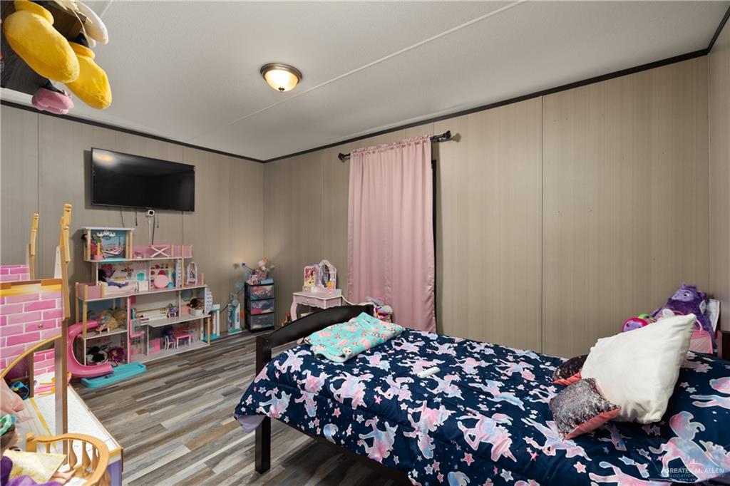 3118 Primrose Drive Weslaco, TX 78596 - Photo 9 of 12 Bedroom with wood finished floors