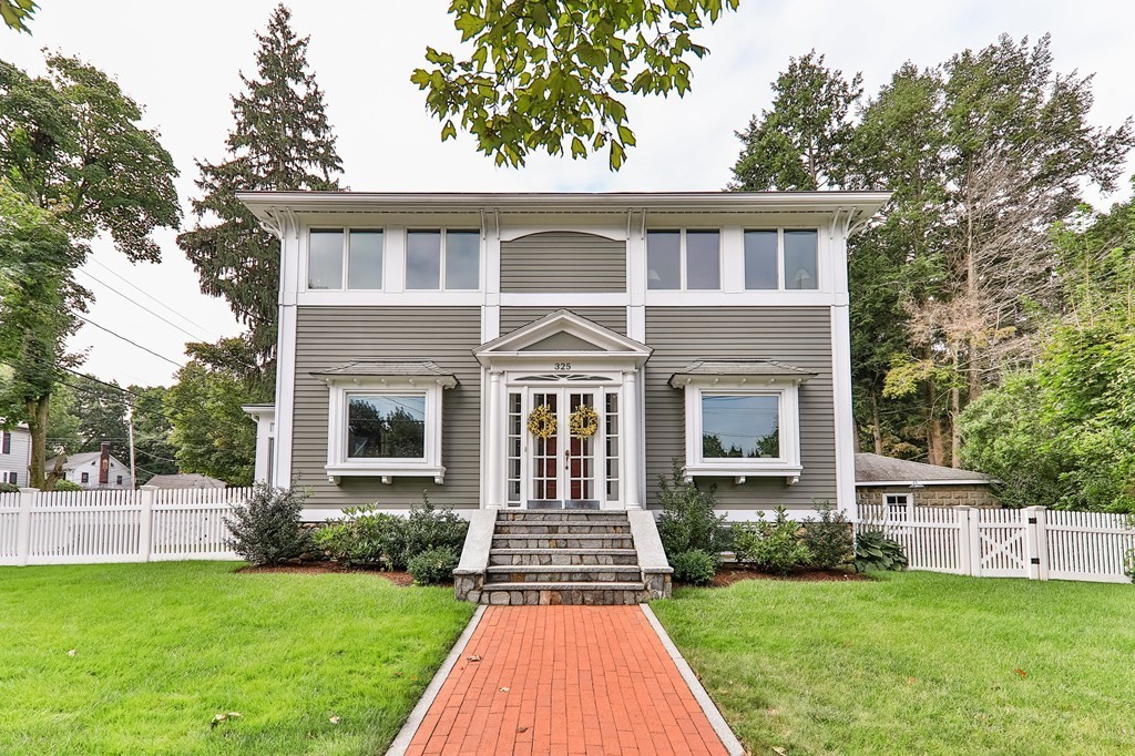 325 Reedsdale Road Milton, MA 02186 - Photo 2 of 23 a front view of a house with yard