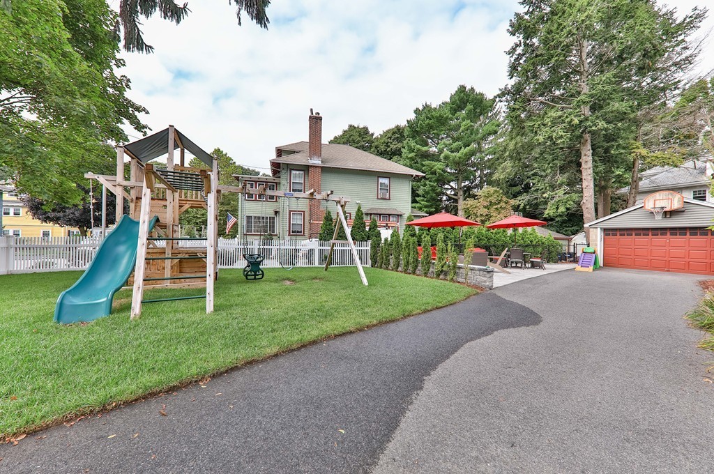 325 Reedsdale Road Milton, MA 02186 - Photo 21 of 23 a view of a house with a yard and plants