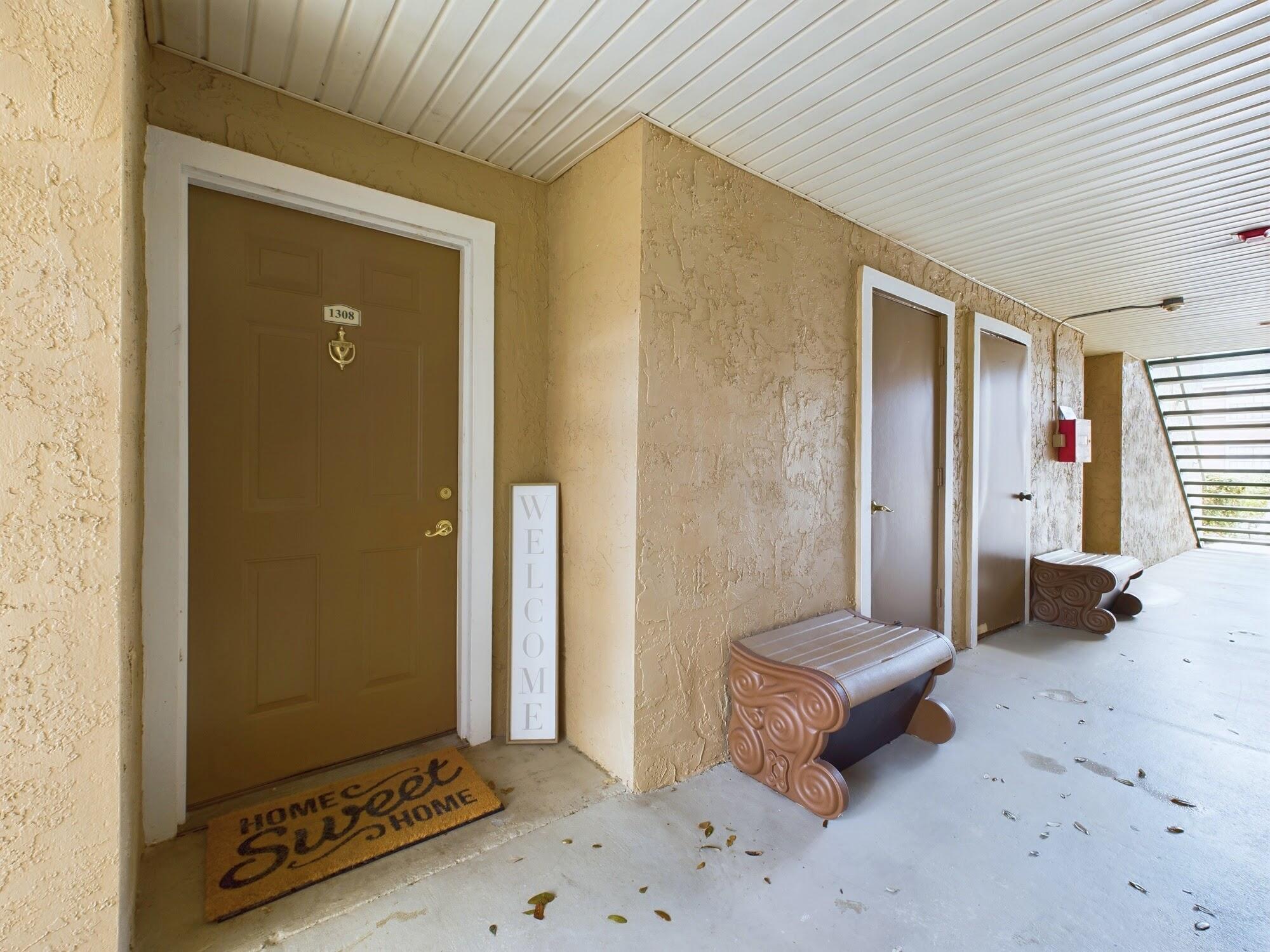 7667 North Wickham Road, Unit 1308 Melbourne, FL 32940 - Photo 2 of 56 a living room with furniture and a window