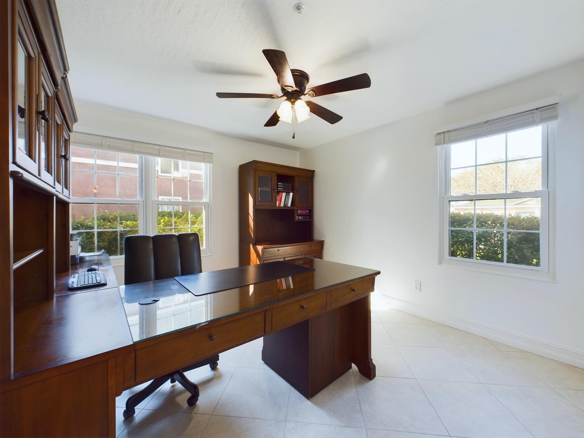 7667 North Wickham Road, Unit 1308 Melbourne, FL 32940 - Photo 49 of 56 a view of a workspace with furniture and a window