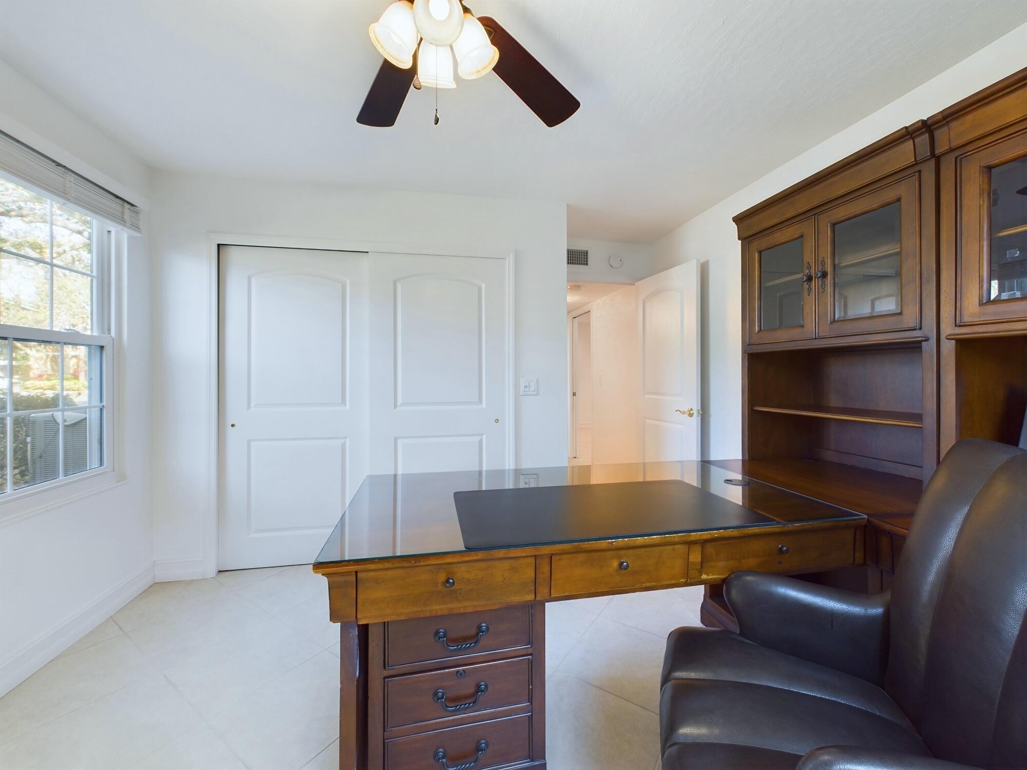 7667 North Wickham Road, Unit 1308 Melbourne, FL 32940 - Photo 51 of 56 a room with furniture and window