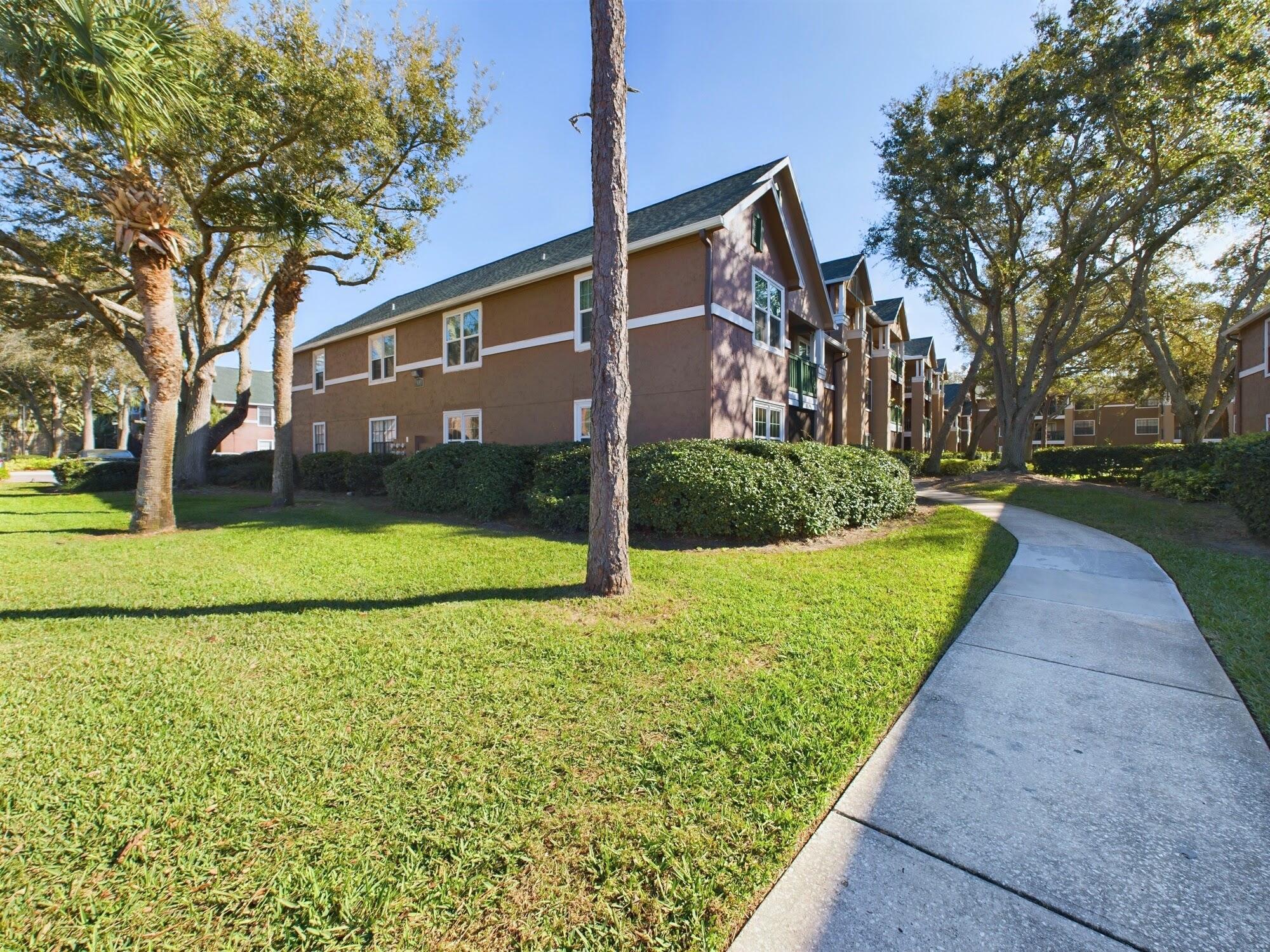 7667 North Wickham Road, Unit 1308 Melbourne, FL 32940 - Photo 54 of 56 a view of a house with a yard