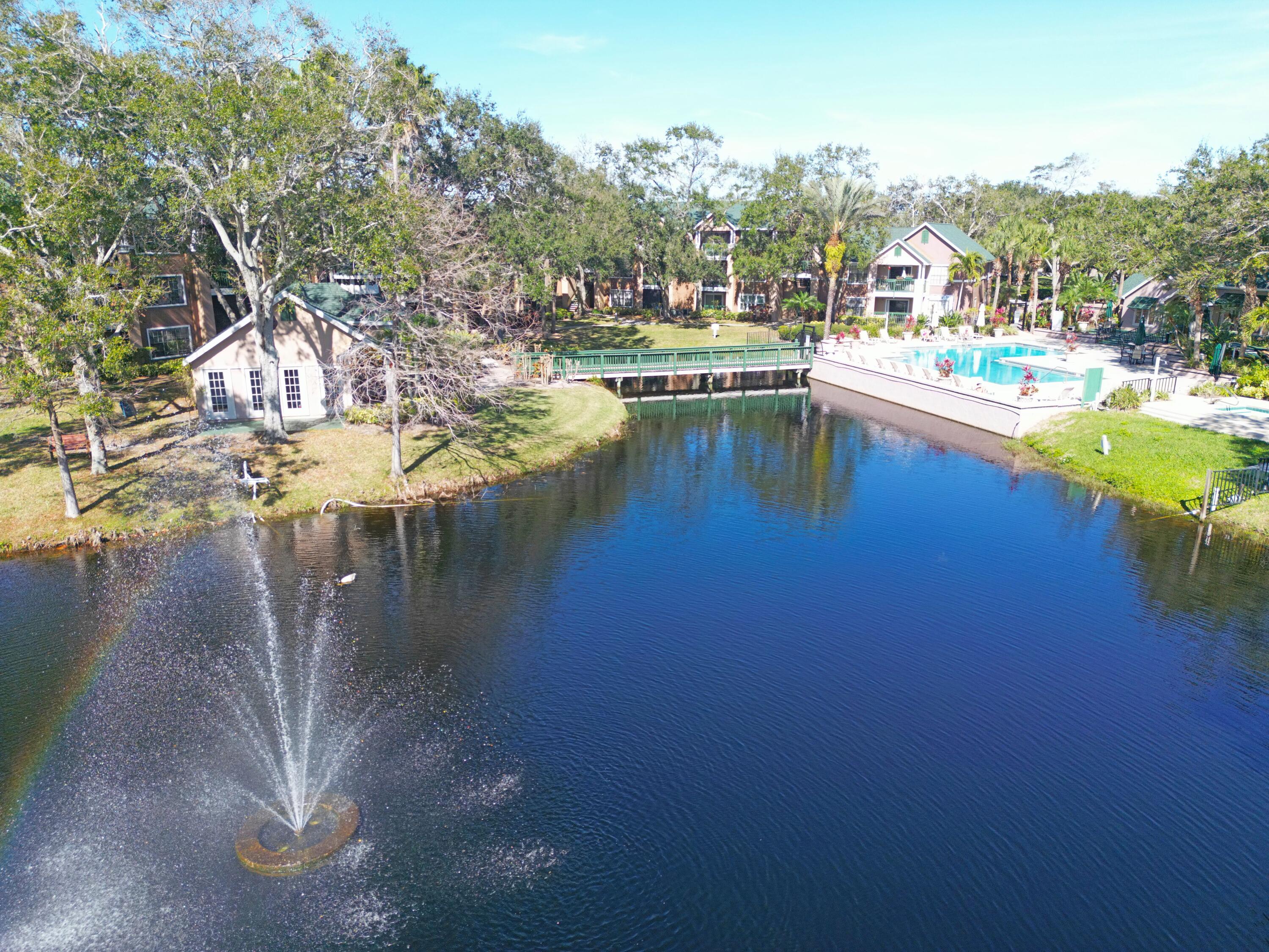 7667 North Wickham Road, Unit 1308 Melbourne, FL 32940 - Photo 56 of 56 a view of a lake with houses