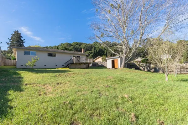 a view of a back yard of the house