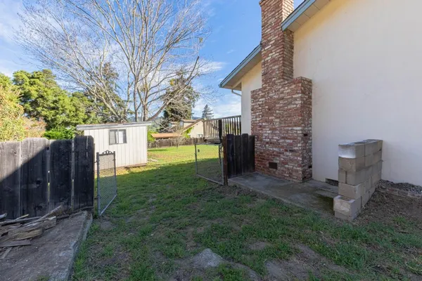 a view of a back yard of the house