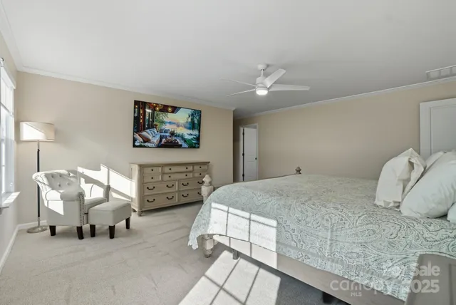 a bedroom with a bed and a chair