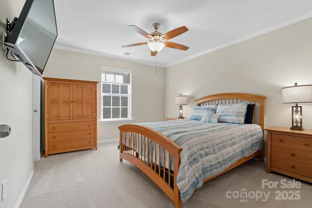 a bedroom with a bed a window and closet