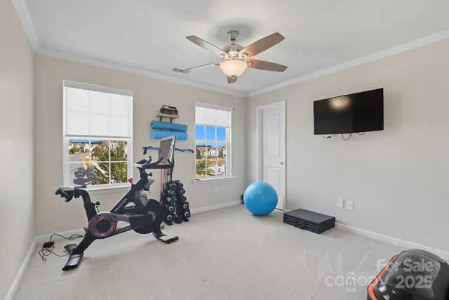 a view of a livingroom with workspace and a window
