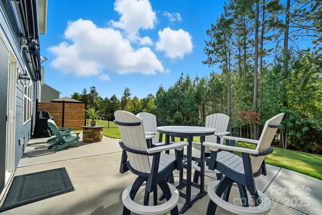 a view of a chairs and table in the patio