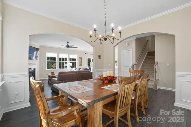 a view of a dining room with furniture and window