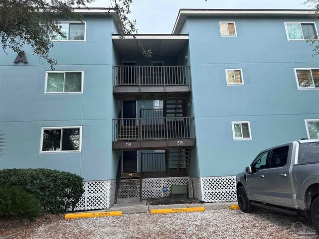 a view of a house with pool and a couch