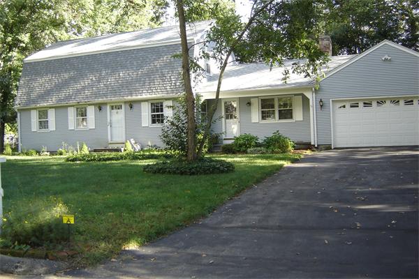 51 Metacomet Road Longmeadow, MA 01106 - Photo 1 of 3 a front view of a house with a garden and yard