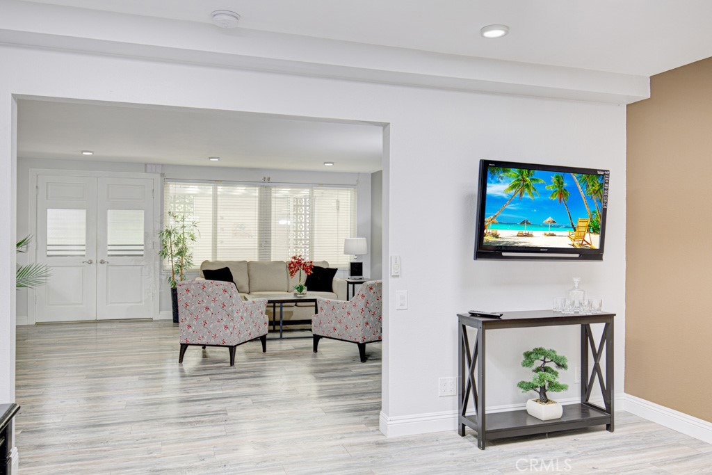 245 Calle Aragon, Unit C Laguna Woods, CA 92637 - Photo 12 of 32 a living room with furniture a rug and a fireplace
