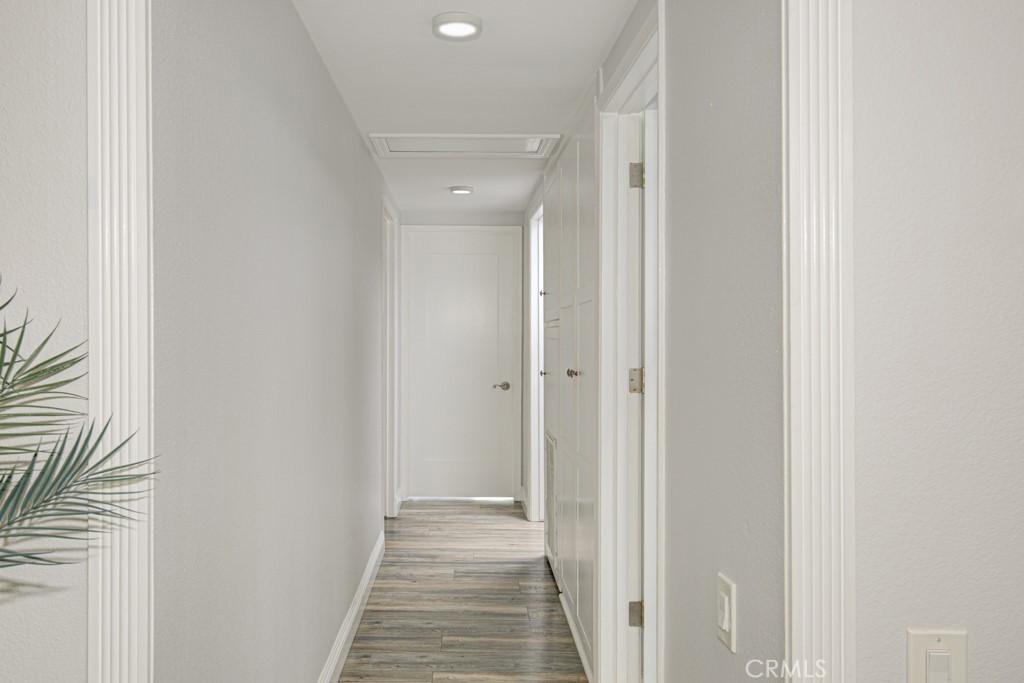 245 Calle Aragon, Unit C Laguna Woods, CA 92637 - Photo 14 of 32 a view of a hallway with a glass door