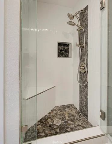 a view of a hallway with a door and stairs