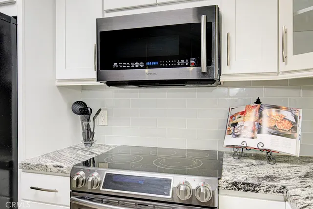 a kitchen with a stove and a microwave
