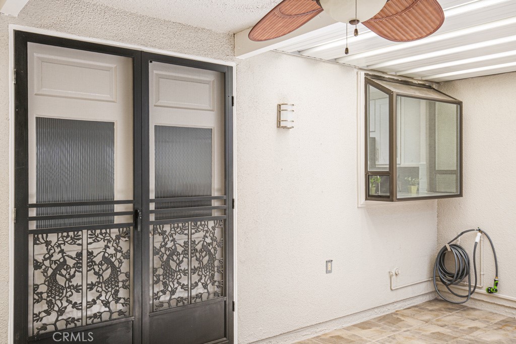 245 Calle Aragon, Unit C Laguna Woods, CA 92637 - Photo 31 of 32 a front view of a house with entryway