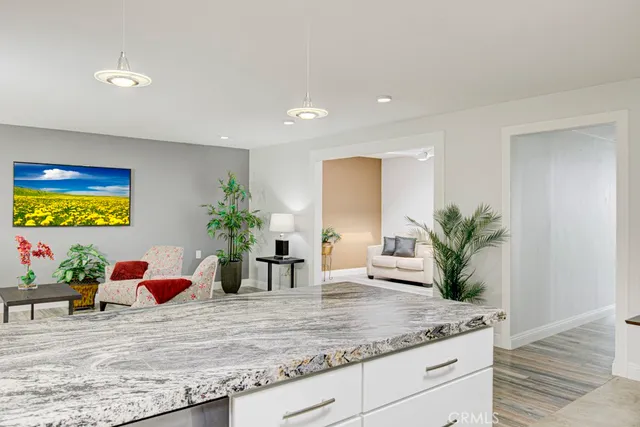 a kitchen with kitchen island sink and faucet