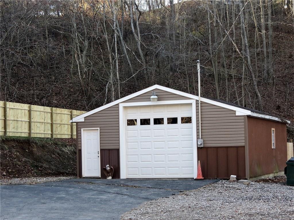 551 Chapel Road Aliquippa, PA 15001 - Photo 18 of 19 Fantastic heated 30X24 garage with a dedicated electrical service, furnace, 10ft door & 11ft ceiling perfect for the mechanic or hobbyist!