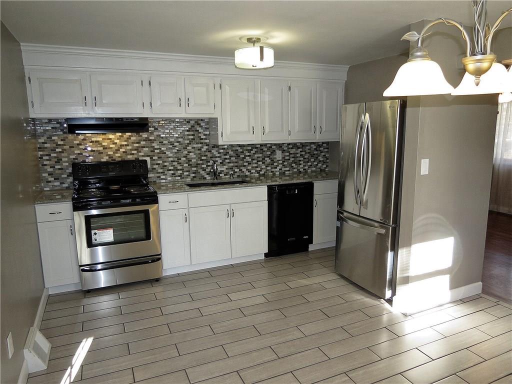 The 15X12 Eat in Kitchen includes granite counter tops, SS appliances & ceramic tile floors.
