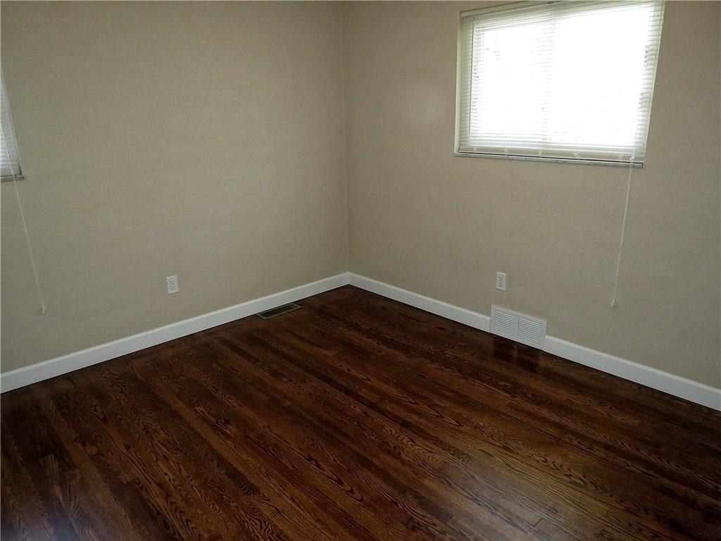 551 Chapel Road Aliquippa, PA 15001 - Photo 9 of 19 The 11.5 X 10.5 master bedroom includes beautiful walnut stained hardwood floors.