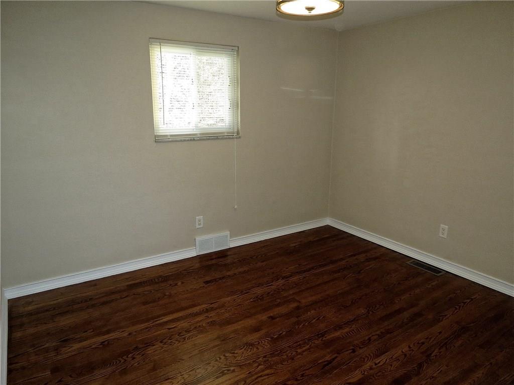 551 Chapel Road Aliquippa, PA 15001 - Photo 10 of 19 A 11.5X10 bedroom includes beautiful walnut stained hardwood floors.