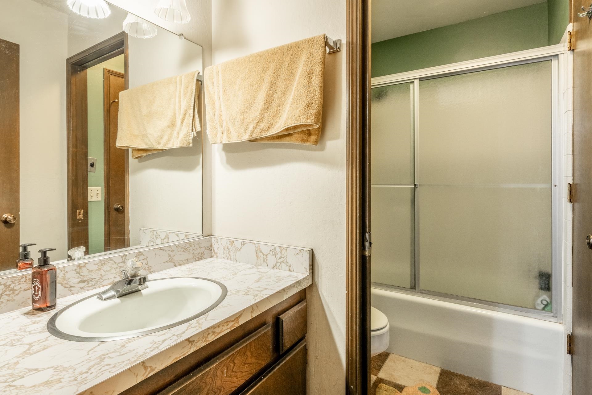 3251 Chateau Road, Unit 38 Mammoth Lakes, CA 93546 - Photo 19 of 50 a bathroom with a granite countertop sink and a mirror