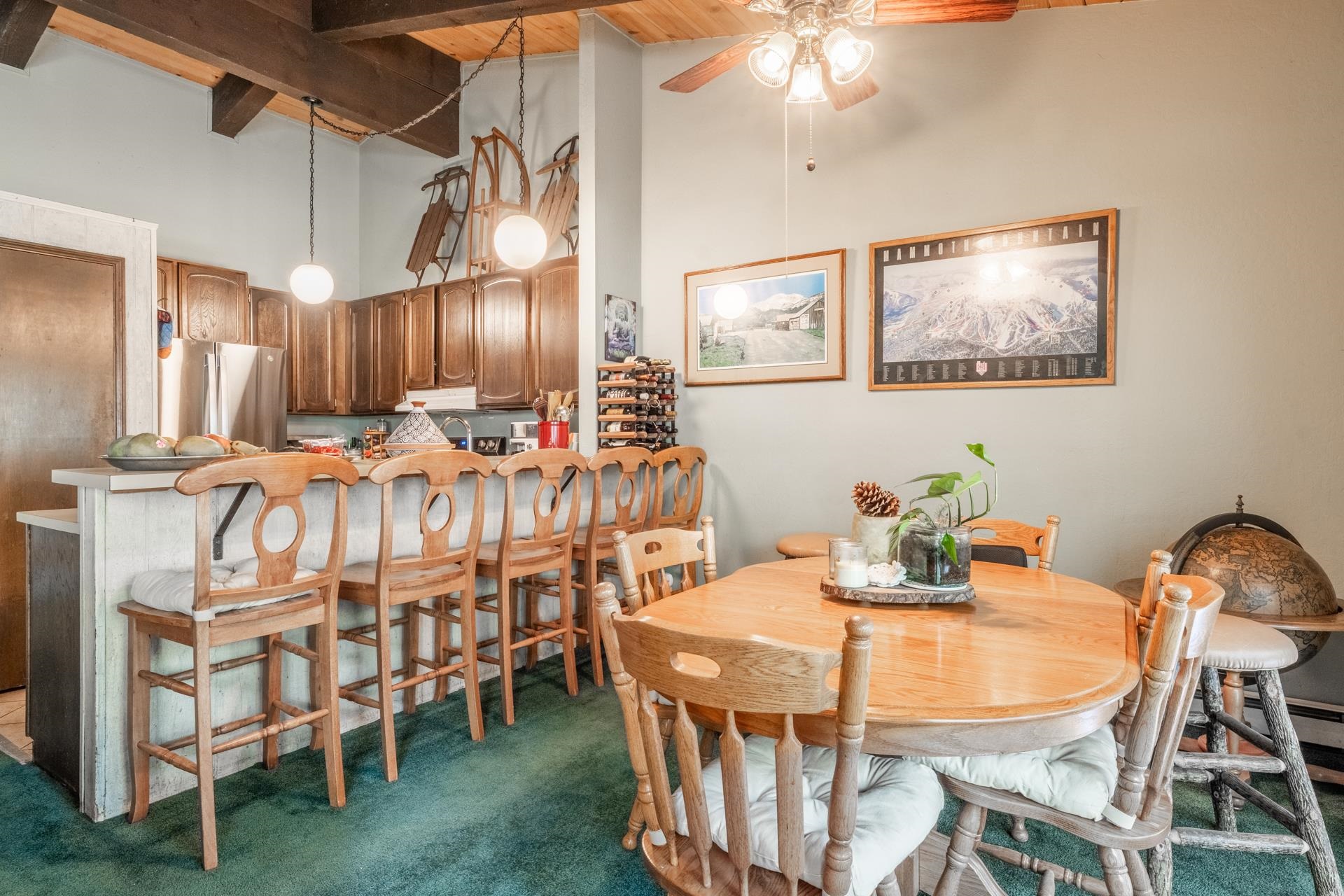 3251 Chateau Road, Unit 38 Mammoth Lakes, CA 93546 - Photo 2 of 50 a dining room with furniture and chandelier