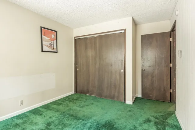 a view of a bathroom with a shower and a sink
