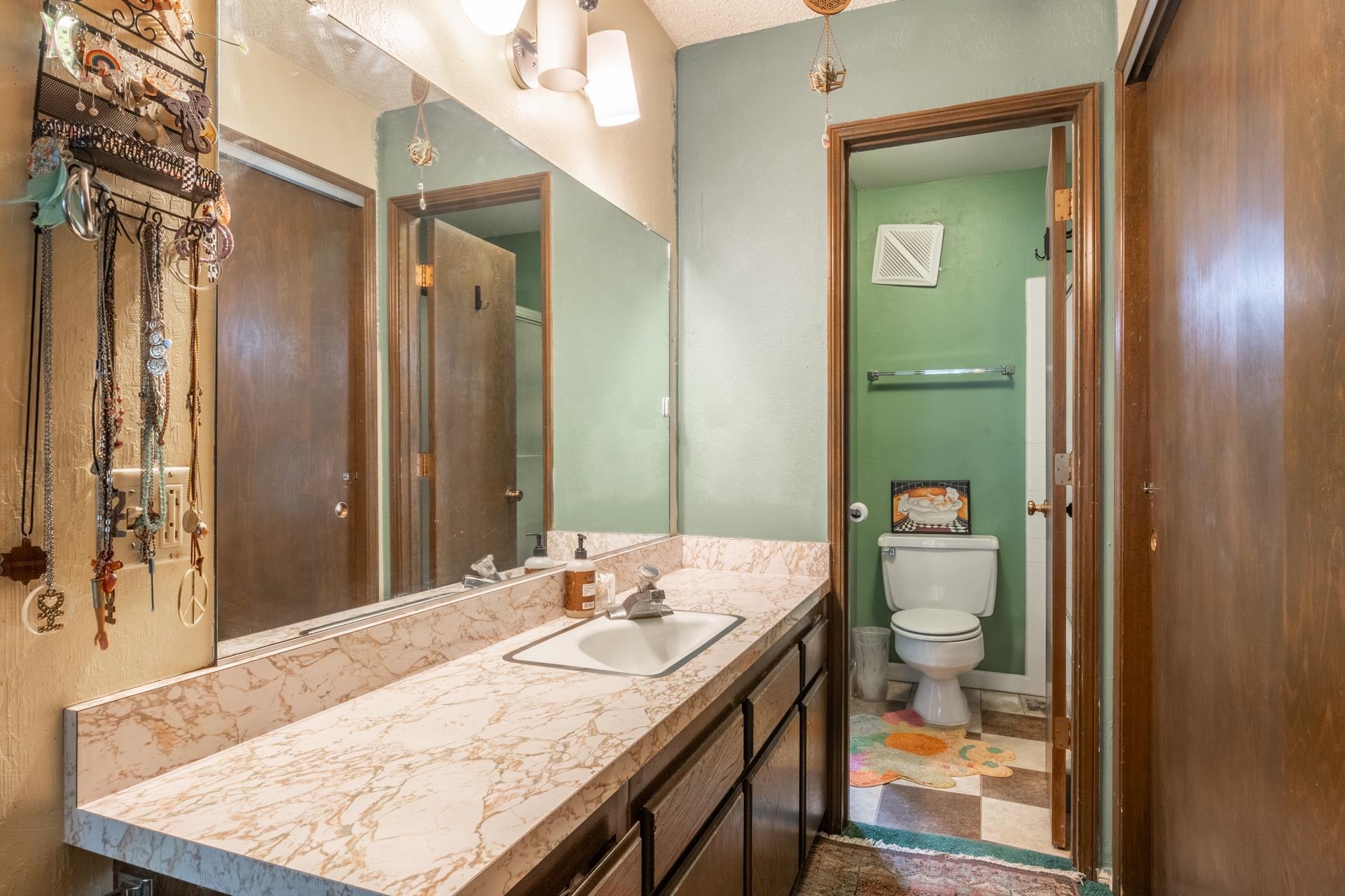 3251 Chateau Road, Unit 38 Mammoth Lakes, CA 93546 - Photo 28 of 50 a bathroom with a granite countertop sink a toilet and shower