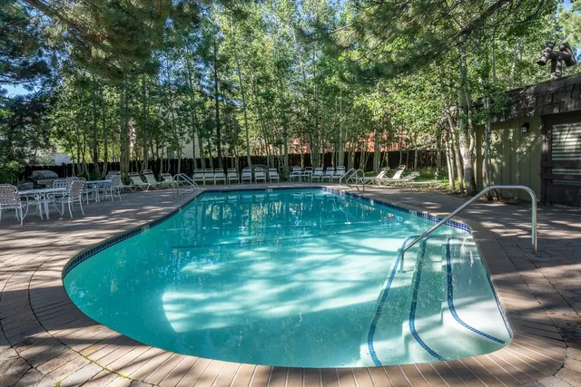 a view of a swimming pool with a sitting area