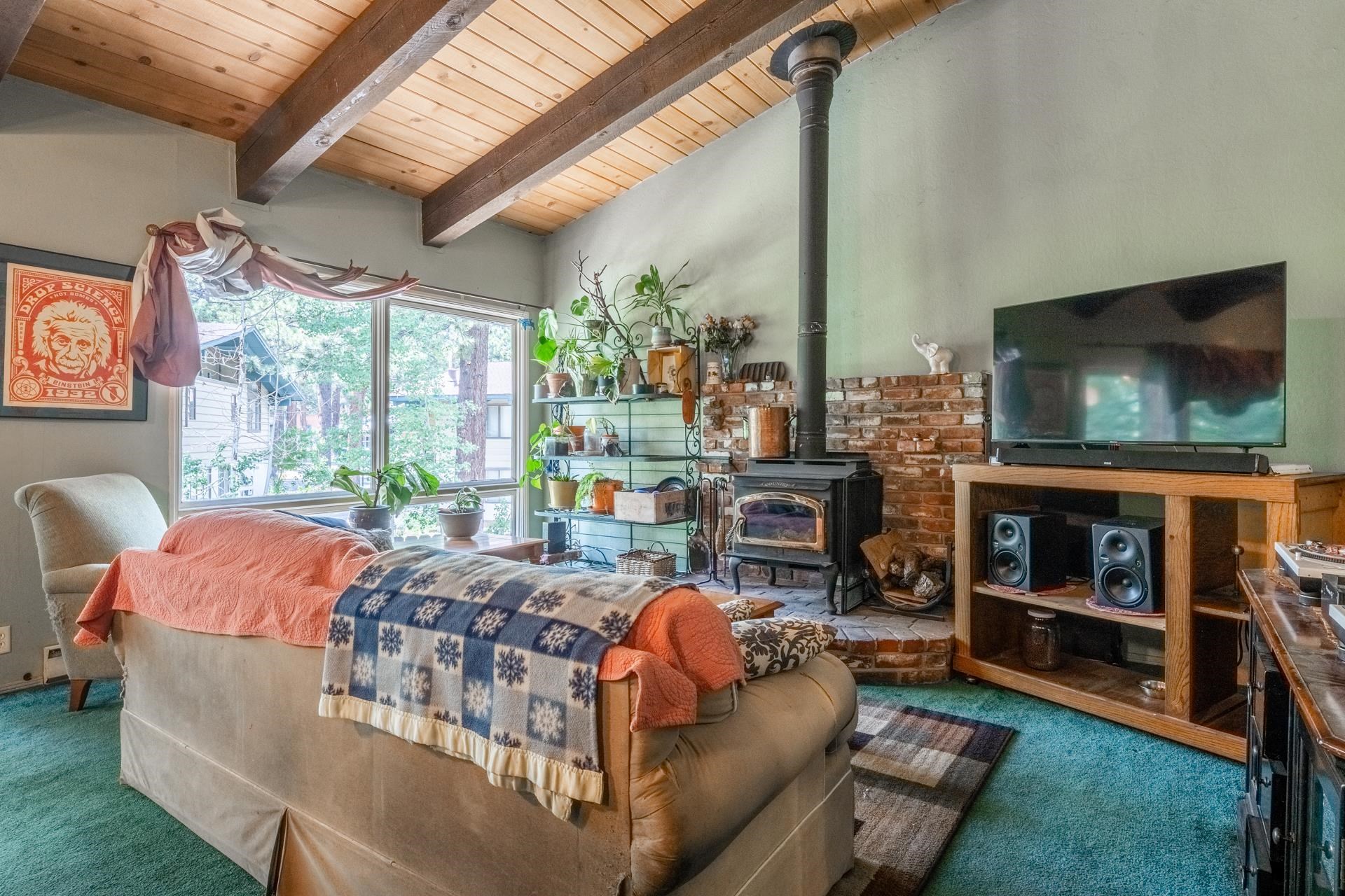 3251 Chateau Road, Unit 38 Mammoth Lakes, CA 93546 - Photo 9 of 50 a living room with fireplace furniture and a flat screen tv