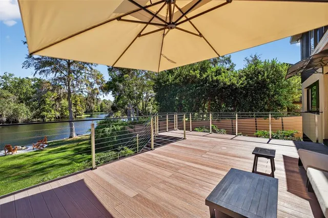 a wooden bench sitting on top of a wooden deck