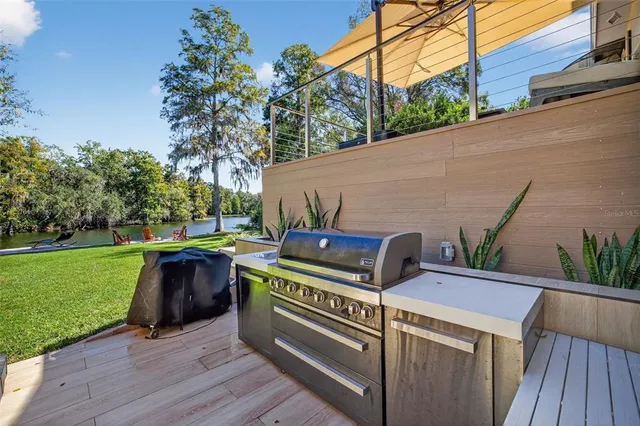 a view of a patio with a table and chairs