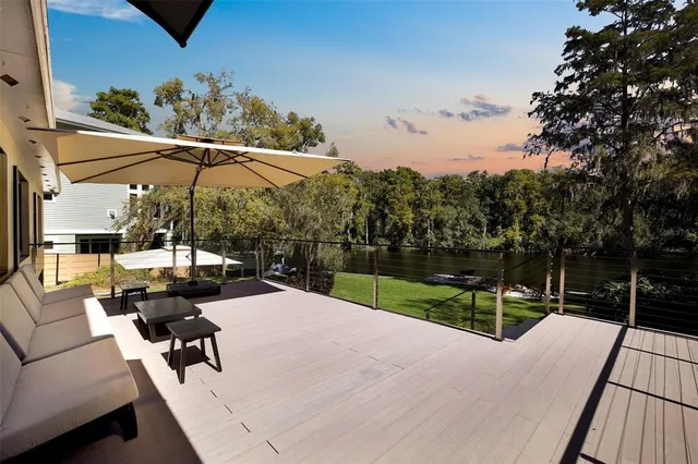 a view of a backyard with sitting area and furniture