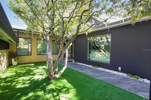 a backyard of a house with seating space