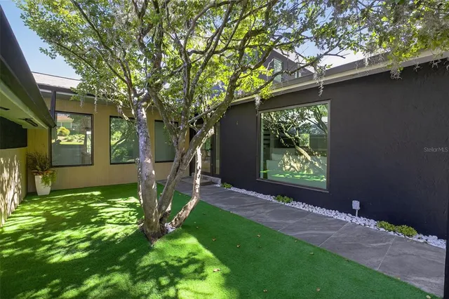a backyard of a house with seating space