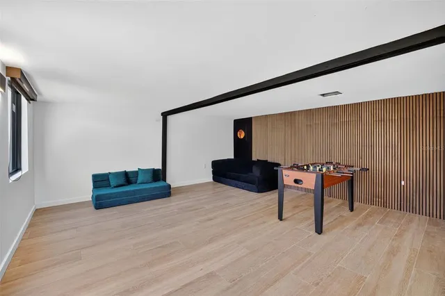 a room with furniture and wooden floor