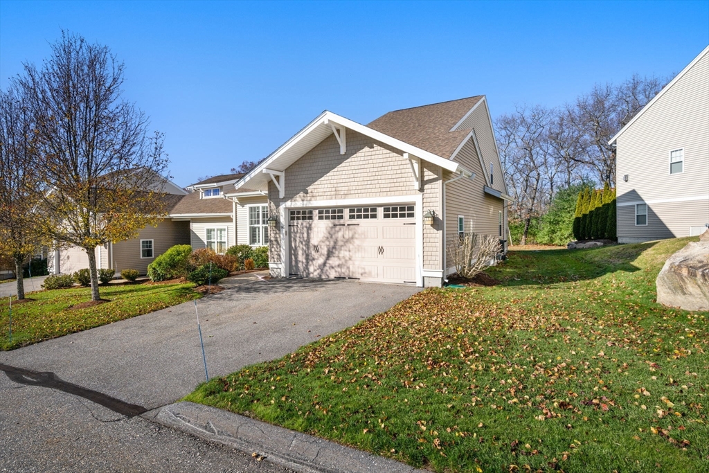 96 Walden Way, Unit 52 Milford, MA 01757 - Photo 1 of 23 a view of a white house with a yard and large tree