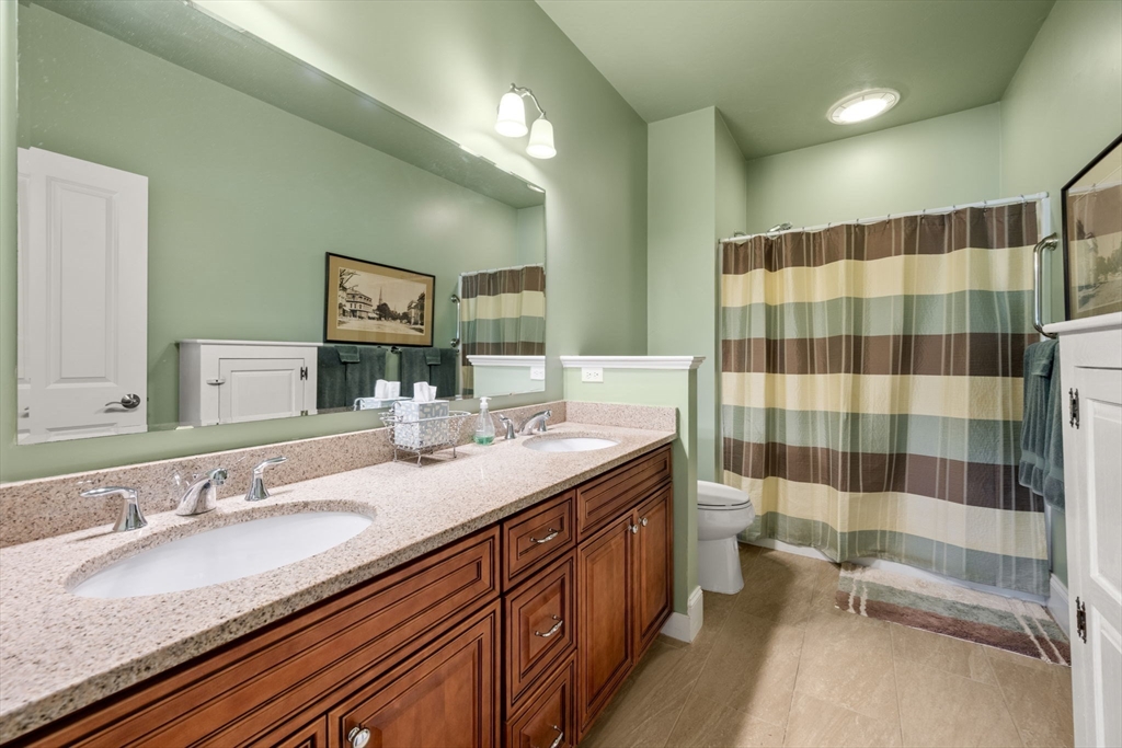 96 Walden Way, Unit 52 Milford, MA 01757 - Photo 11 of 23 a bathroom with a sink a toilet and shower