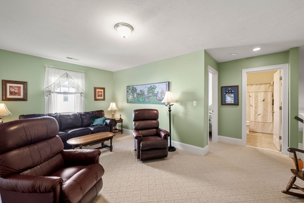 96 Walden Way, Unit 52 Milford, MA 01757 - Photo 17 of 23 a living room with furniture and a window