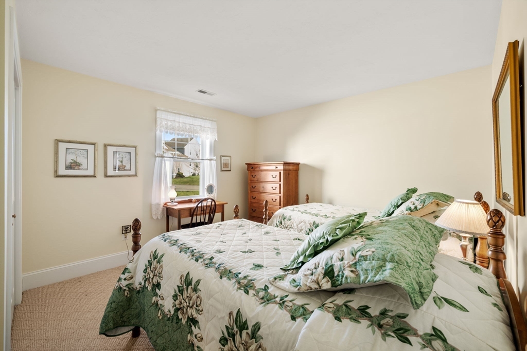 96 Walden Way, Unit 52 Milford, MA 01757 - Photo 18 of 23 a bedroom with a bed and a window